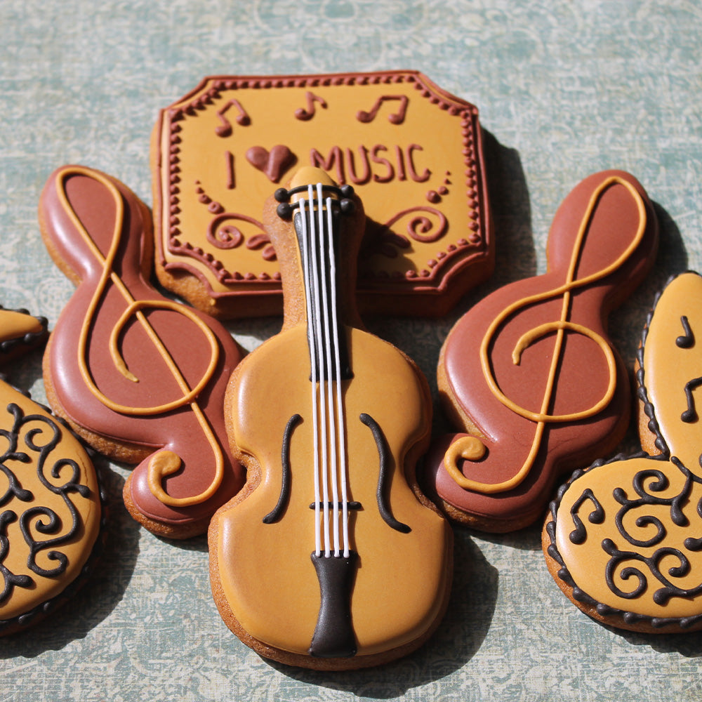 spelt almond cookies in musical note and instrument shapes