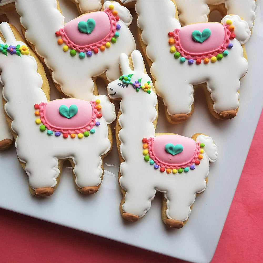 Llama shaped Anise cookies on a white plate