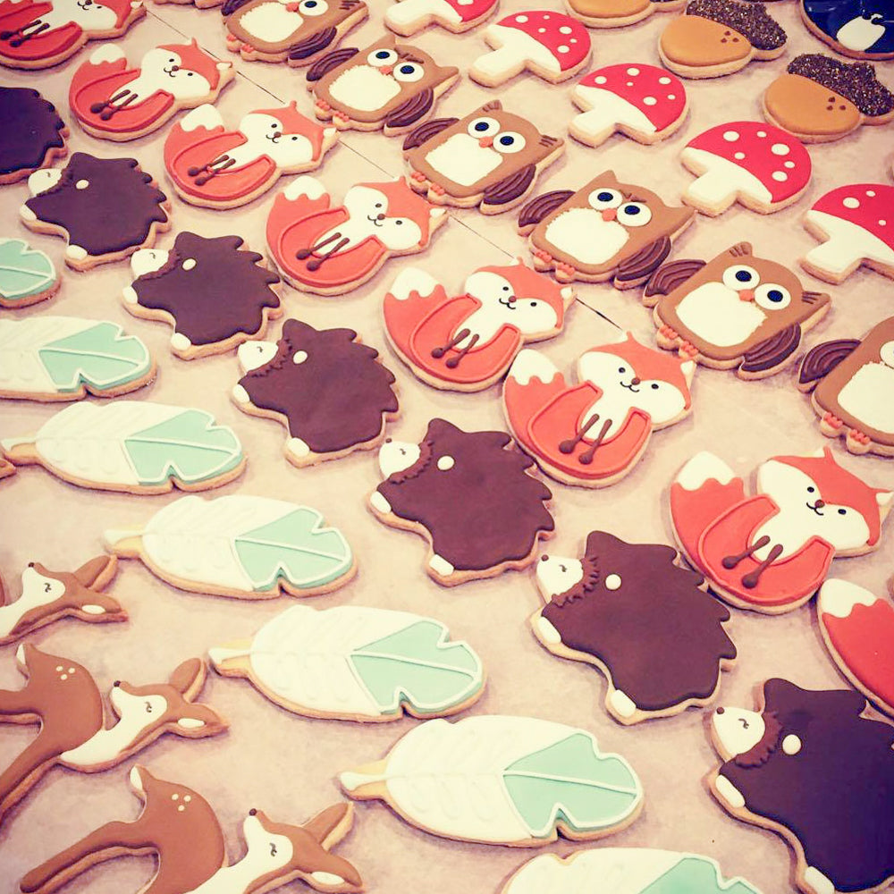 cute woodland cookies on parchment paper