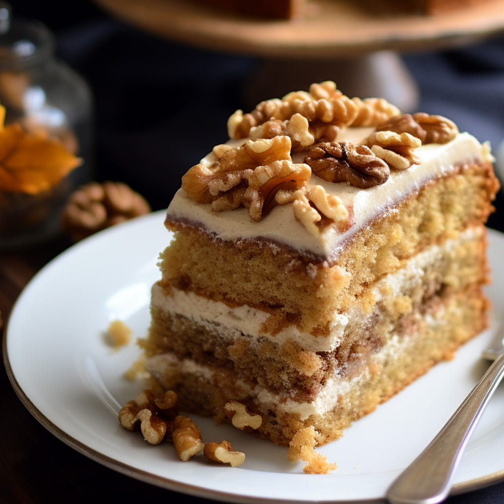 slice of maple walnut cake on a white plate