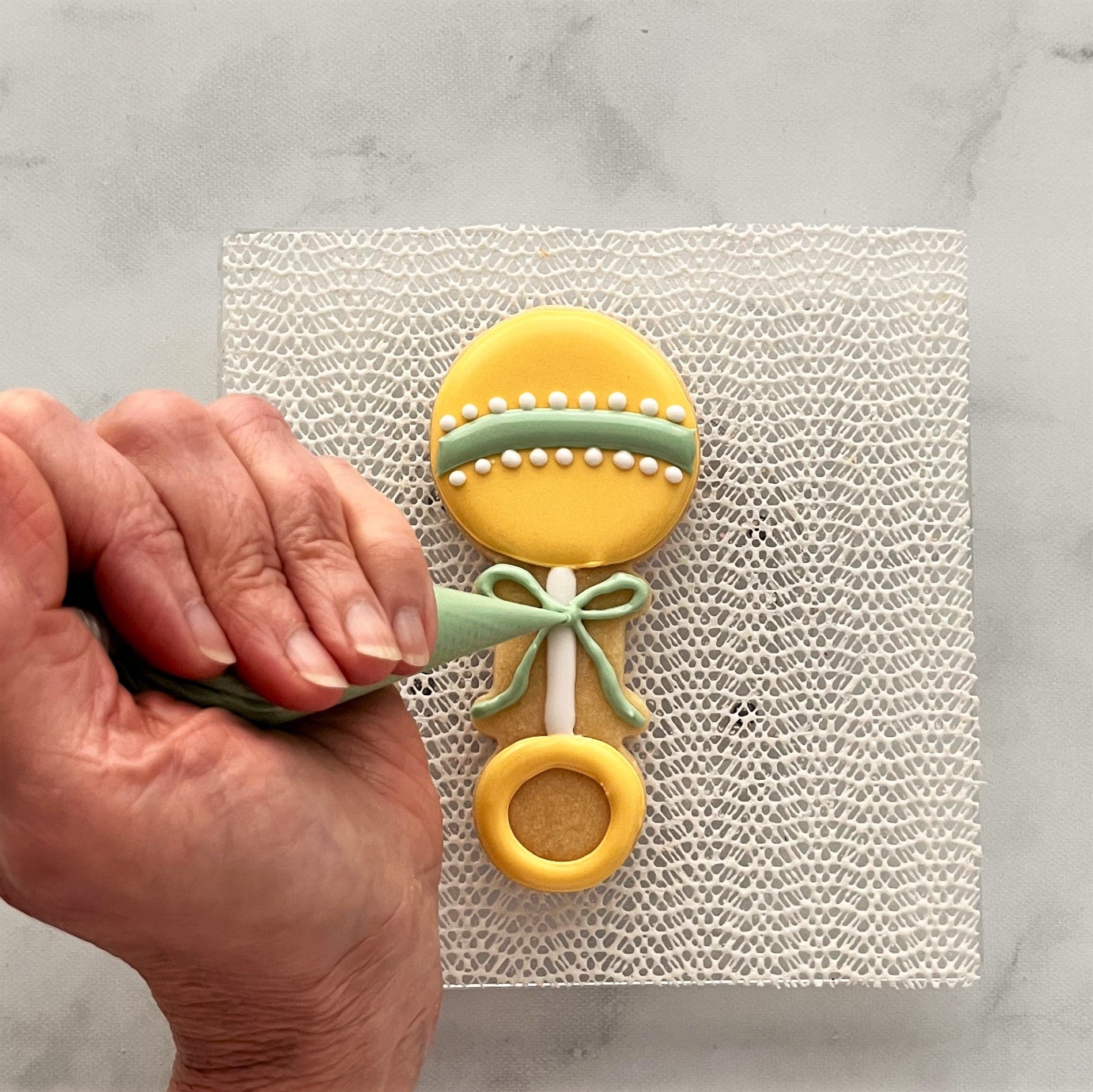 How to Decorate a Baby Rattle Cookie with Royal Icing