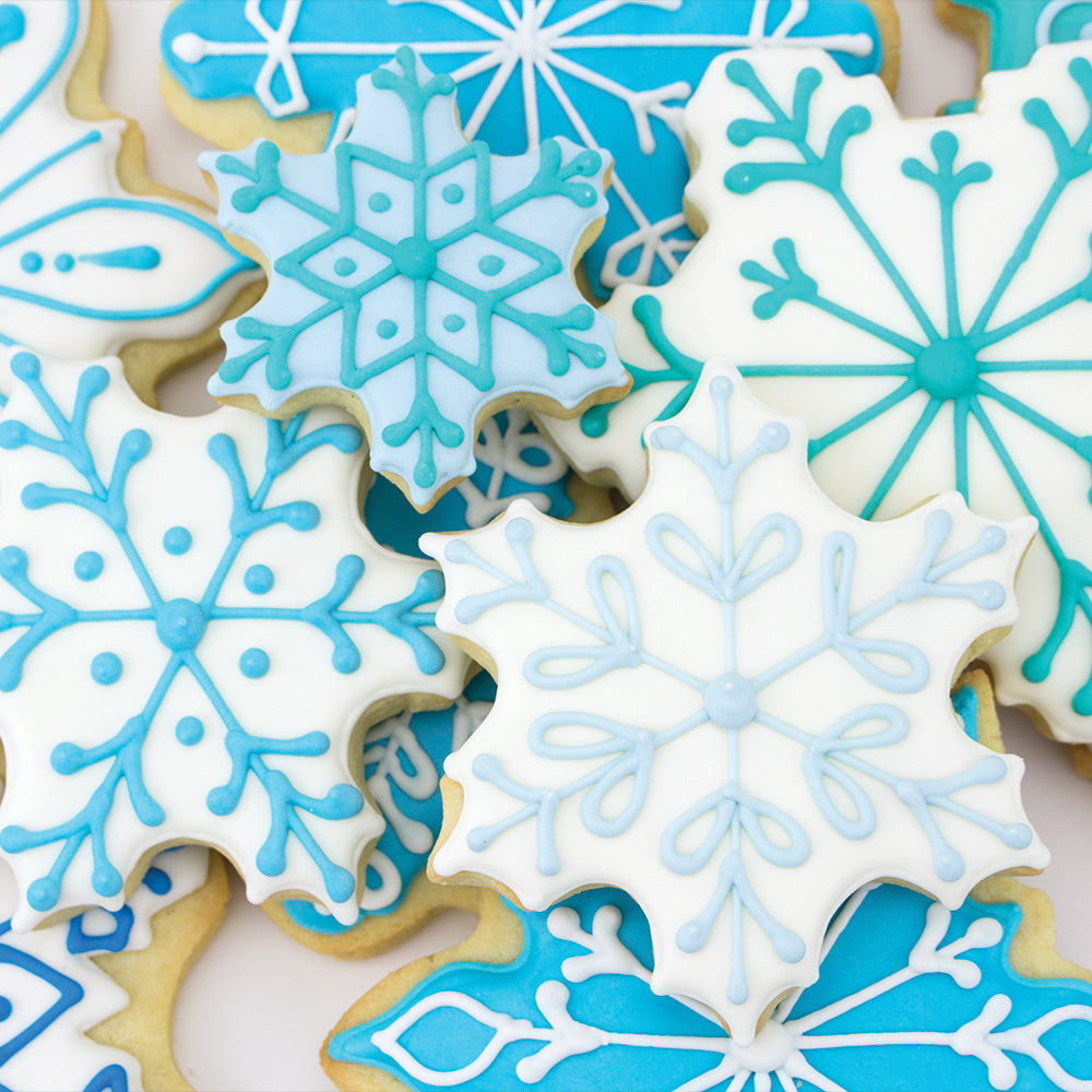 snowflake cookies iced with blue and white royal icing