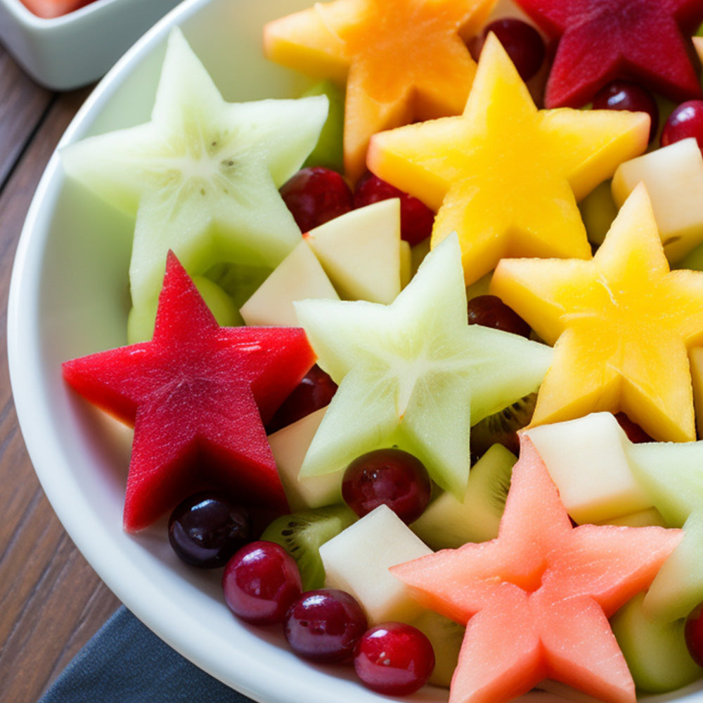 fruit cut into stars in a white bowl