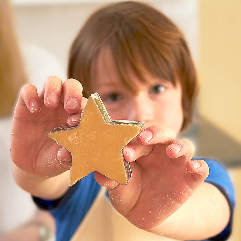 child with star cookie