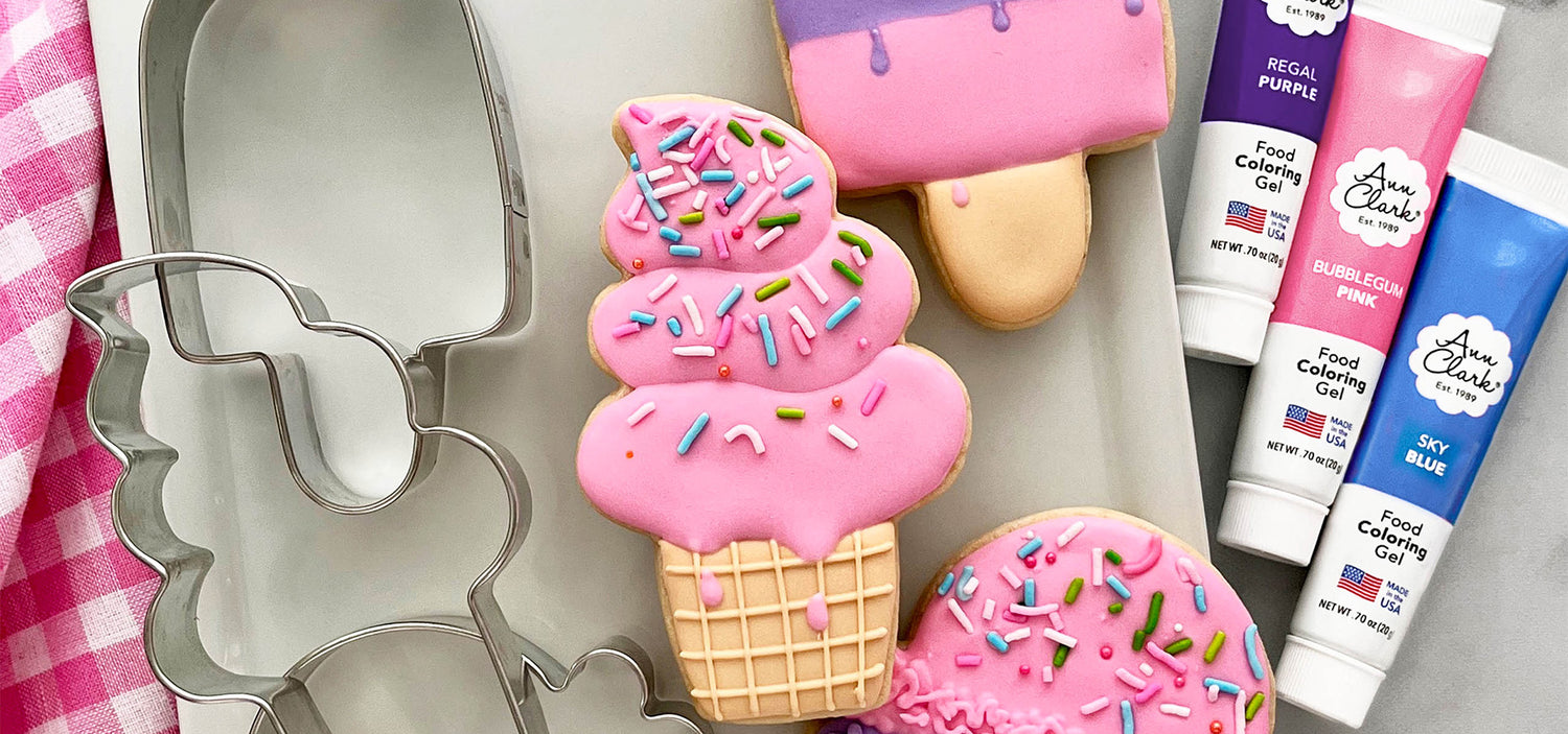 Pink ice cream cookies and cookie cutters with gel food coloring